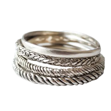 a stack of silver rings on white background