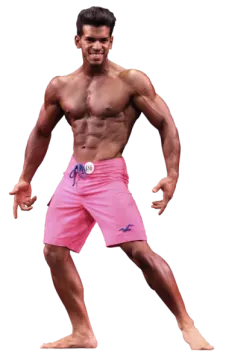 a man in pink shorts posing for the camera