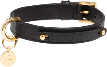a black leather bracelet with a gold charm