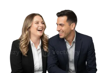 a man and woman sitting at a table laughing