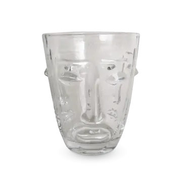 a glass cup with a face on it