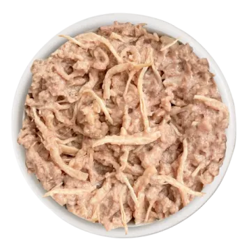 a white bowl filled with cooked chicken