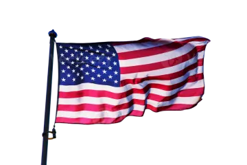 an american flag flying in the wind