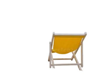 a yellow beach chair sitting in the sand