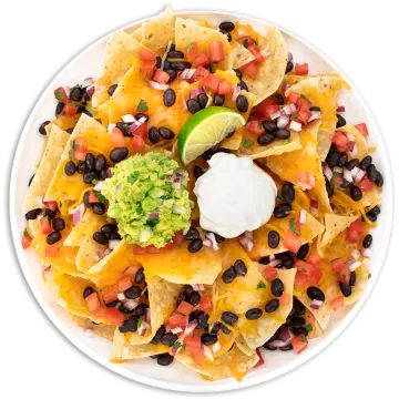 a white plate topped with black beans, cheese, tomatoes, and gule