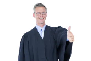 a man in a suit and tie giving the thumbs