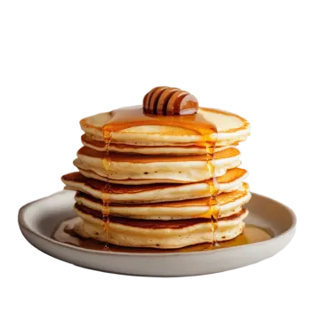 a stack of pancakes with syrup on top