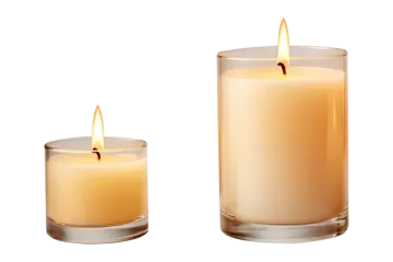 two candles sitting side by side on a white background