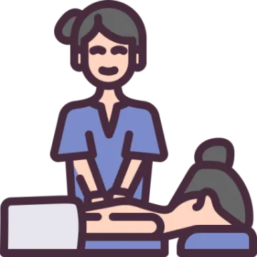 a woman sitting at a desk with her laptop