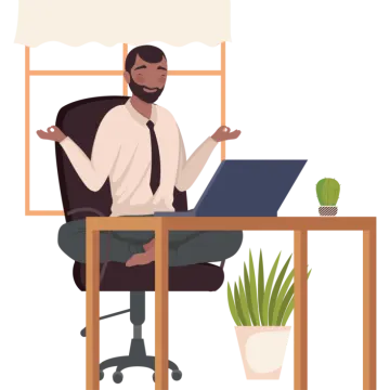 a man sitting at a desk with his laptop