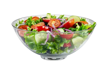 a salad in a glass bowl on a white background