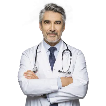 a man in a white coat and tie standing with his arms crossed