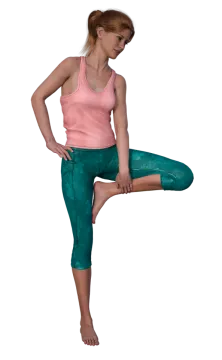 a woman in green leggings and pink tank top