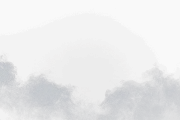 a plane flying through the clouds in the sky