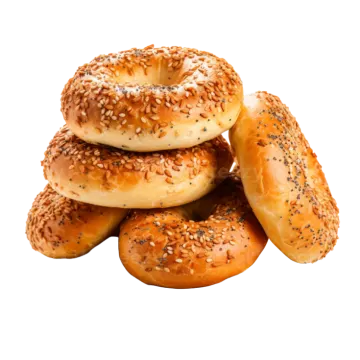 a pile of bagels on a wooden plate