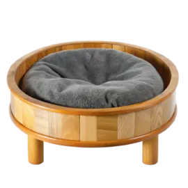 a wooden dog bed with grey fur on top