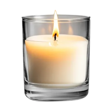 a white candle in a clear glass
