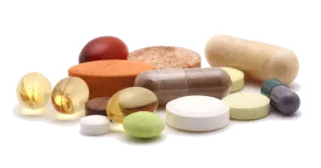 a pile of pills on a white background