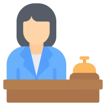 a woman sitting at a table with a tray of food