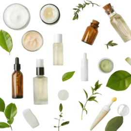 a variety of skin care products with green leaves