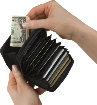 a hand holding a wallet with money inside