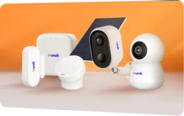 a group of surveillance cameras on an orange background