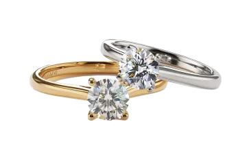 a pair of two gold and silver engagement rings