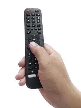 a hand holding a remote control