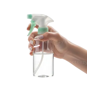 a hand holding a spray bottle filled with water