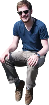 a man in a blue shirt and brown shoes