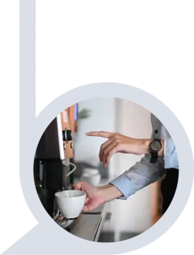 a person holding a coffee cup in their hand