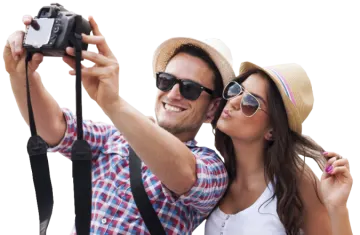 a man and woman taking a picture with a camera