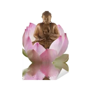 a buddha statue sitting on top of a pink flower