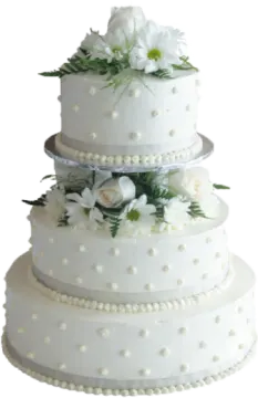 a white wedding cake with flowers on top