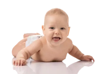 a baby laying on the floor in diapers