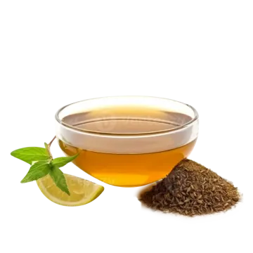 a cup of green tea next to a lemon