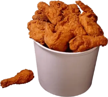 a white cup filled with fried chicken