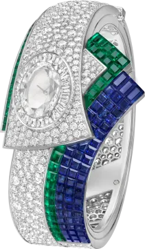 a white gold ring with emerald and blue sapphire stones