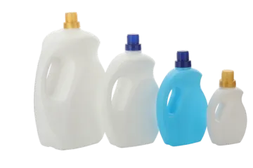 three plastic bottles with blue and white liquids