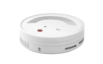 a white smoke detector with a red button