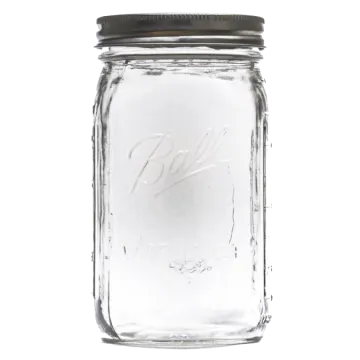 a glass mason jar with a black lid