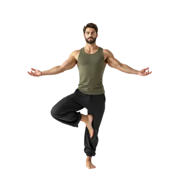 a man in a green tank top and black pants doing yoga
