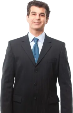 a man in a suit and tie posing for the camera