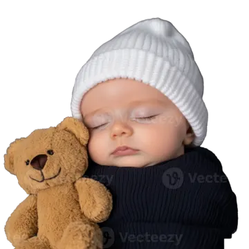 a baby sleeping next to a teddy bear