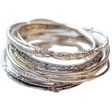 a stack of silver and gold bang bracelets