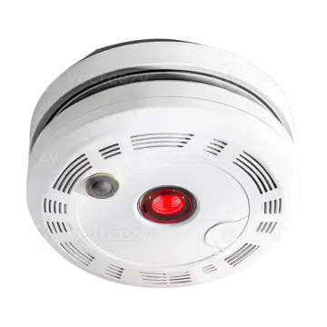 a white smoke detector with red light