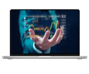 a laptop with an image of a stock market on the screen