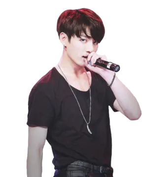 a male in a black shirt singing into a microphone