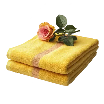 two yellow towels with a rose on top