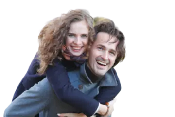 a man carrying a woman on his back